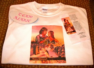 Heroes and Hearts Giveaway Swag There's a t-shirt, a bookmark and a magnet!